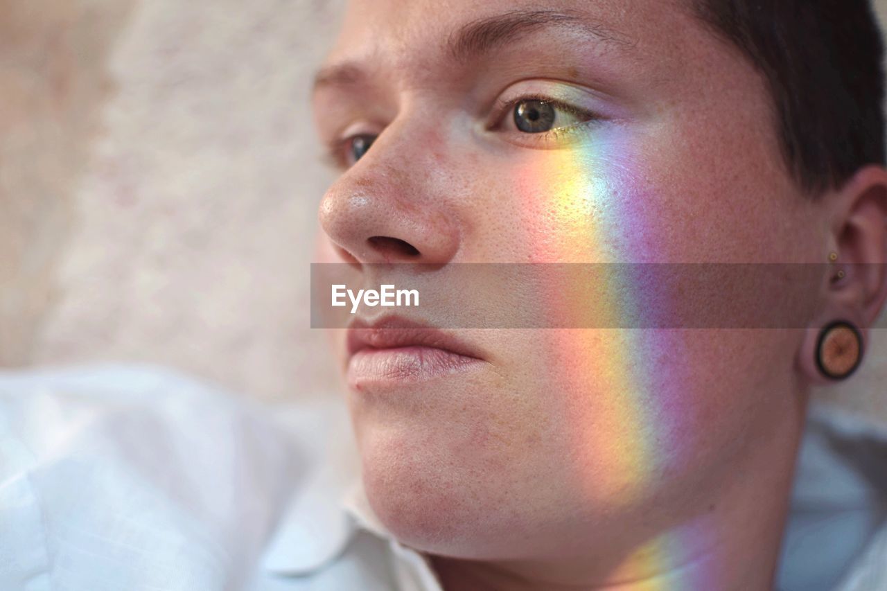 Close-up of man with spectrum on face