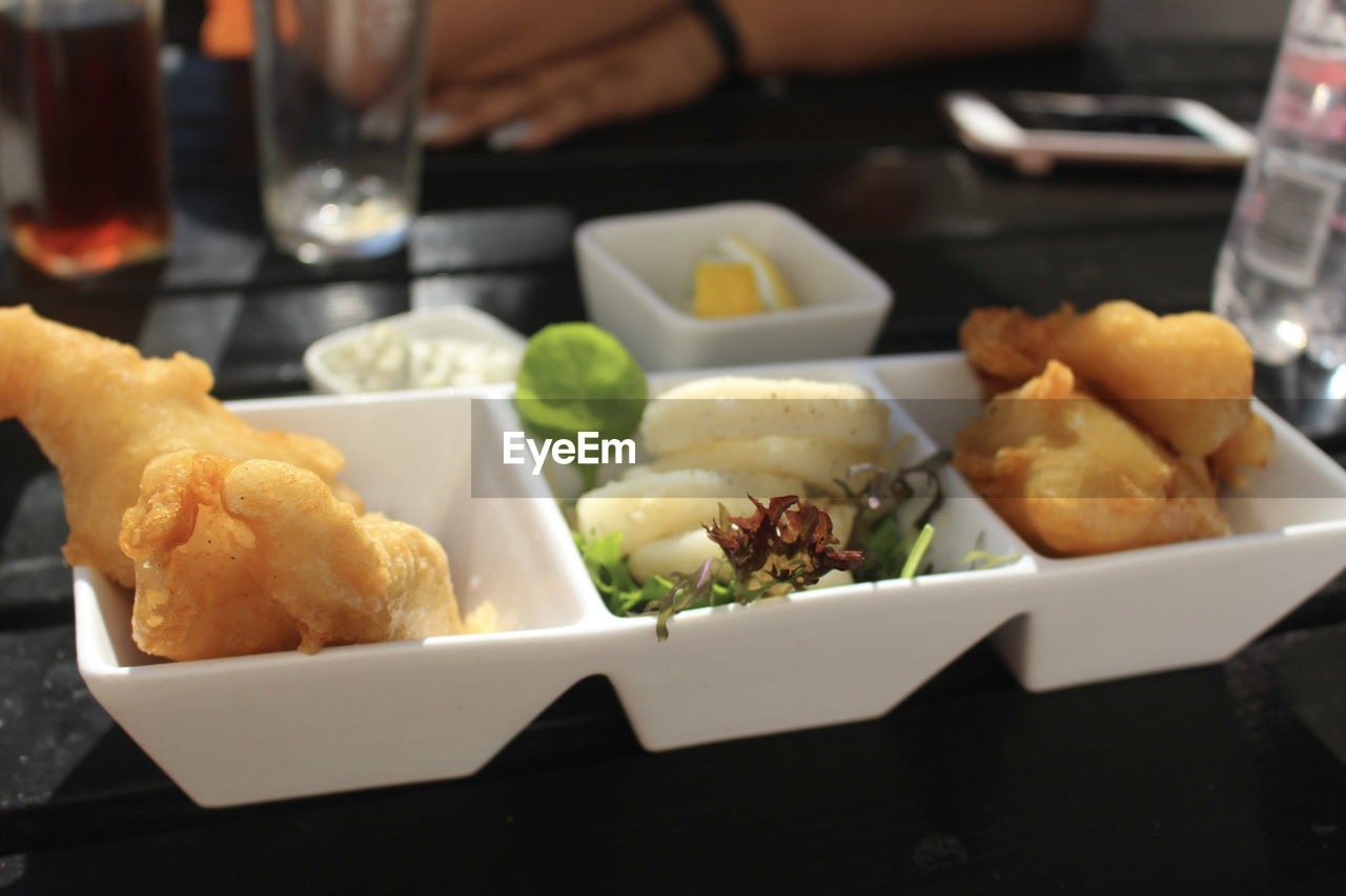 Close-up of food served on table