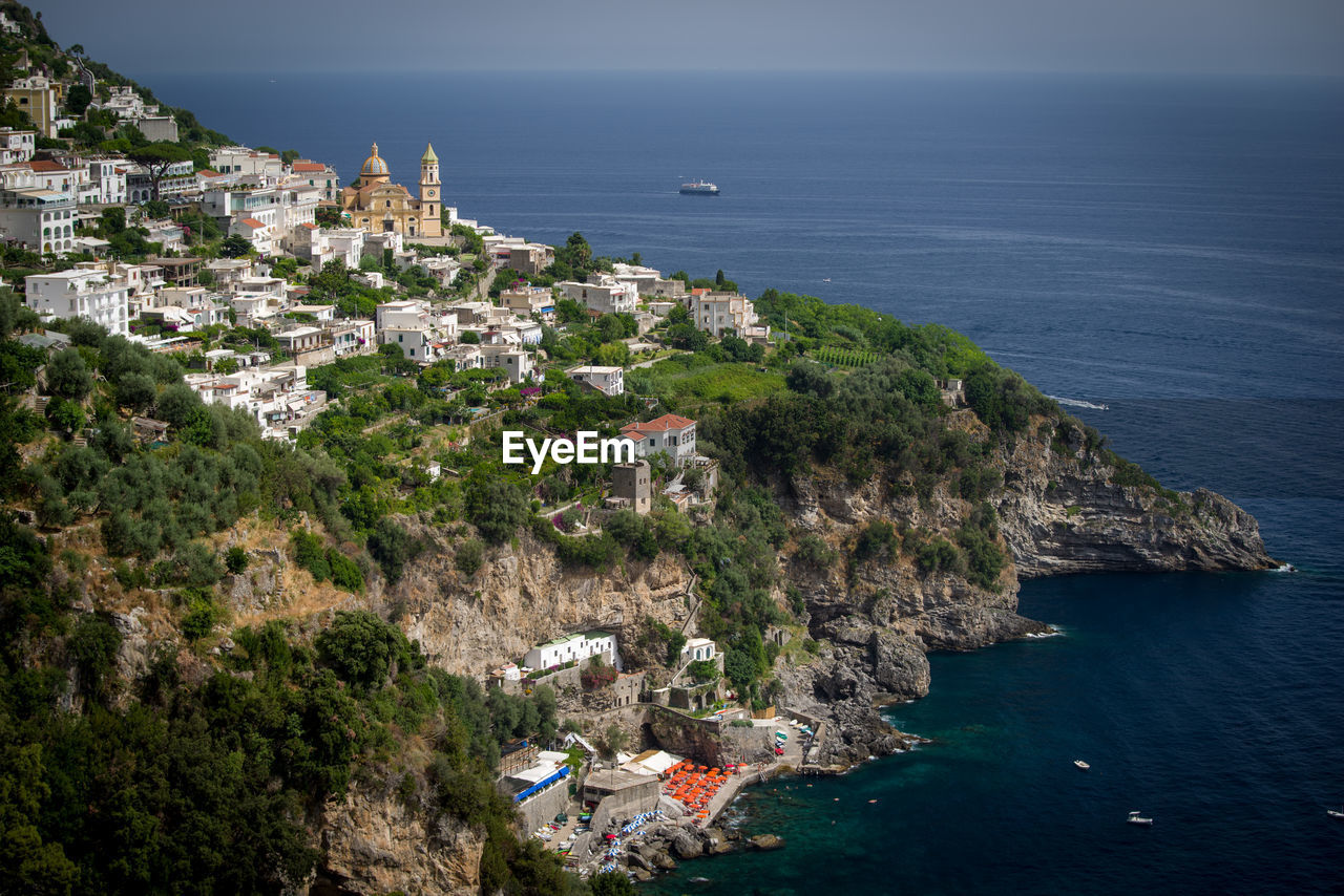 High angle view of townscape by sea