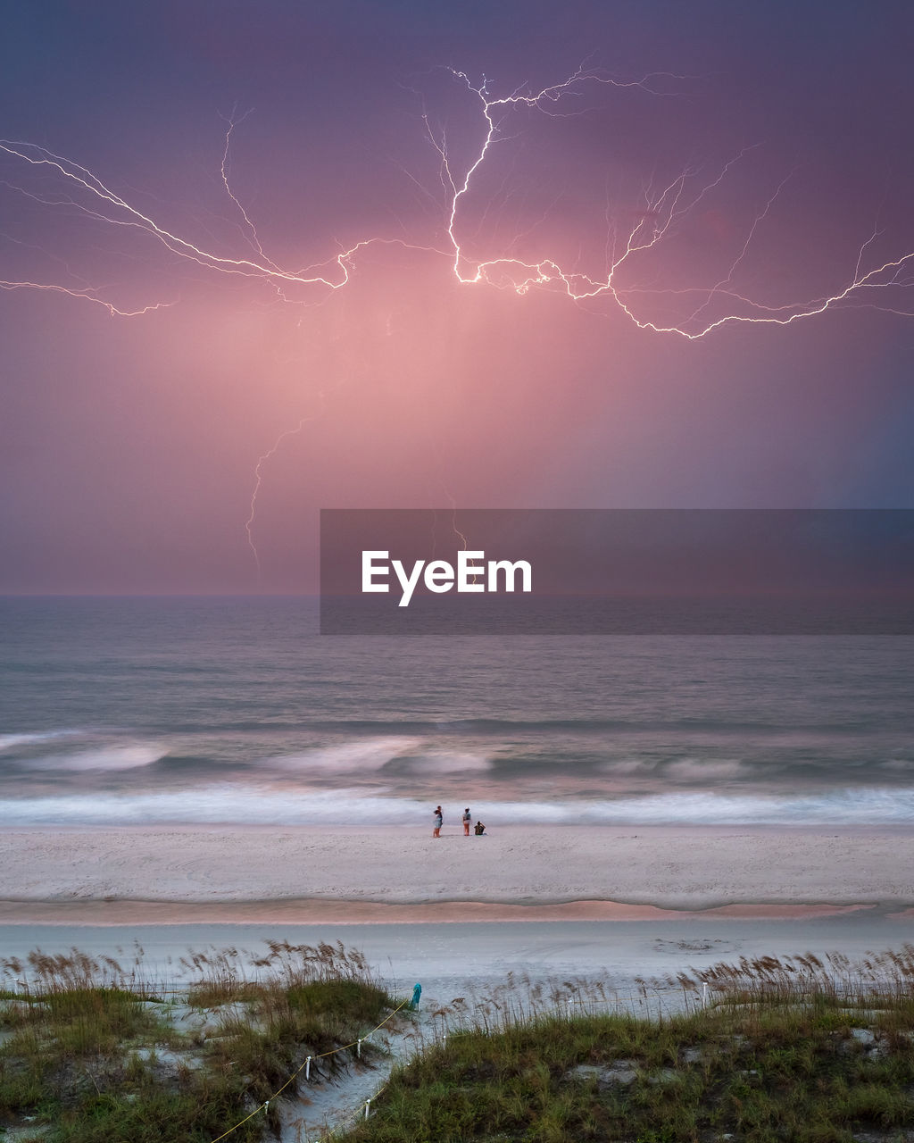 scenic view of beach against sky during sunset