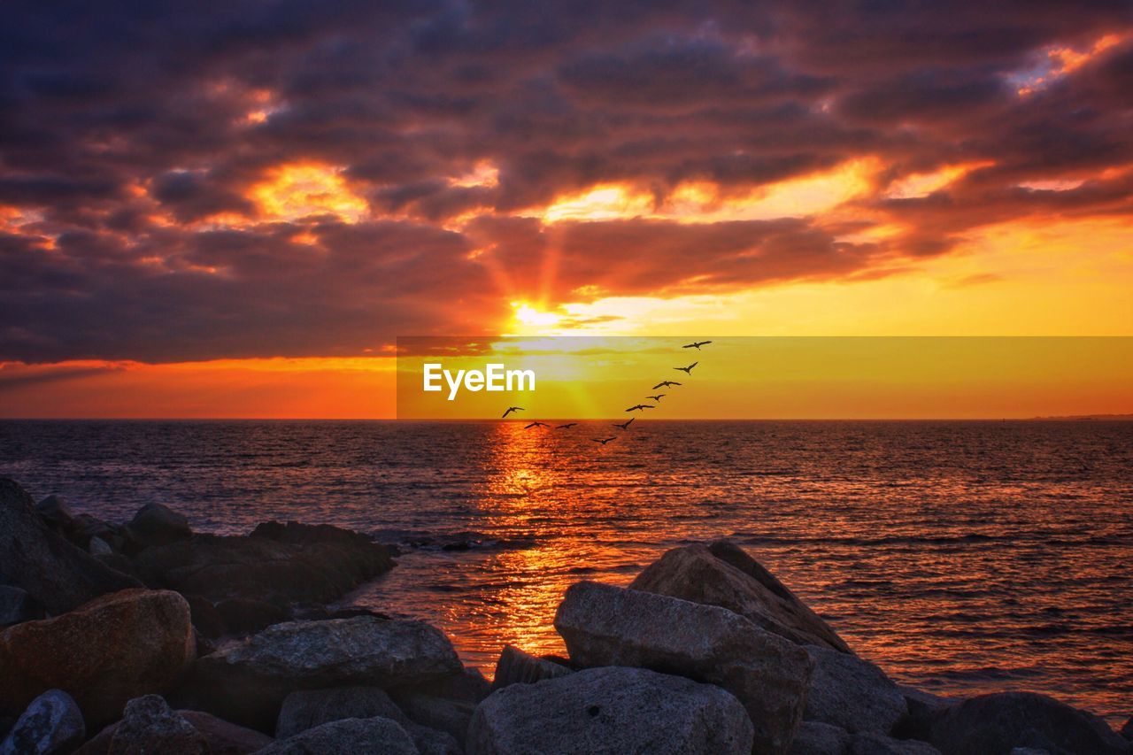 Scenic view of sea against sky during sunset