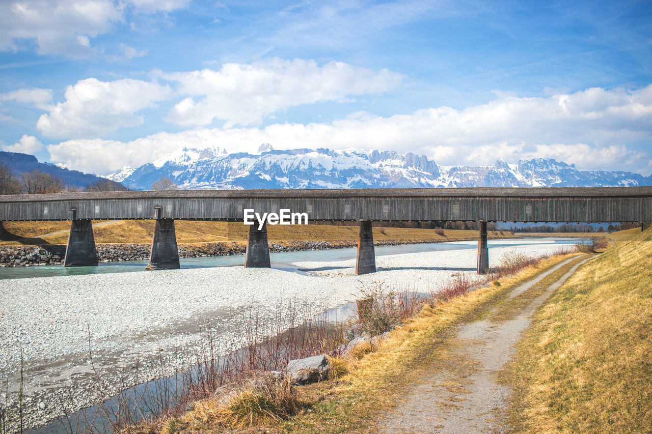 Bridge over river against sky