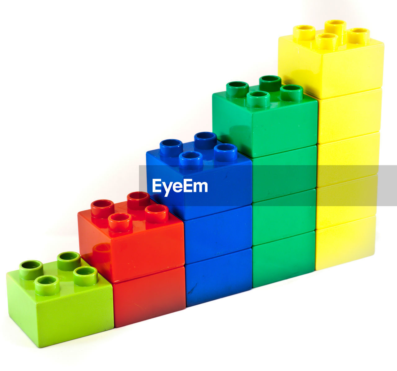 Close-up of colorful toy blocks against white background