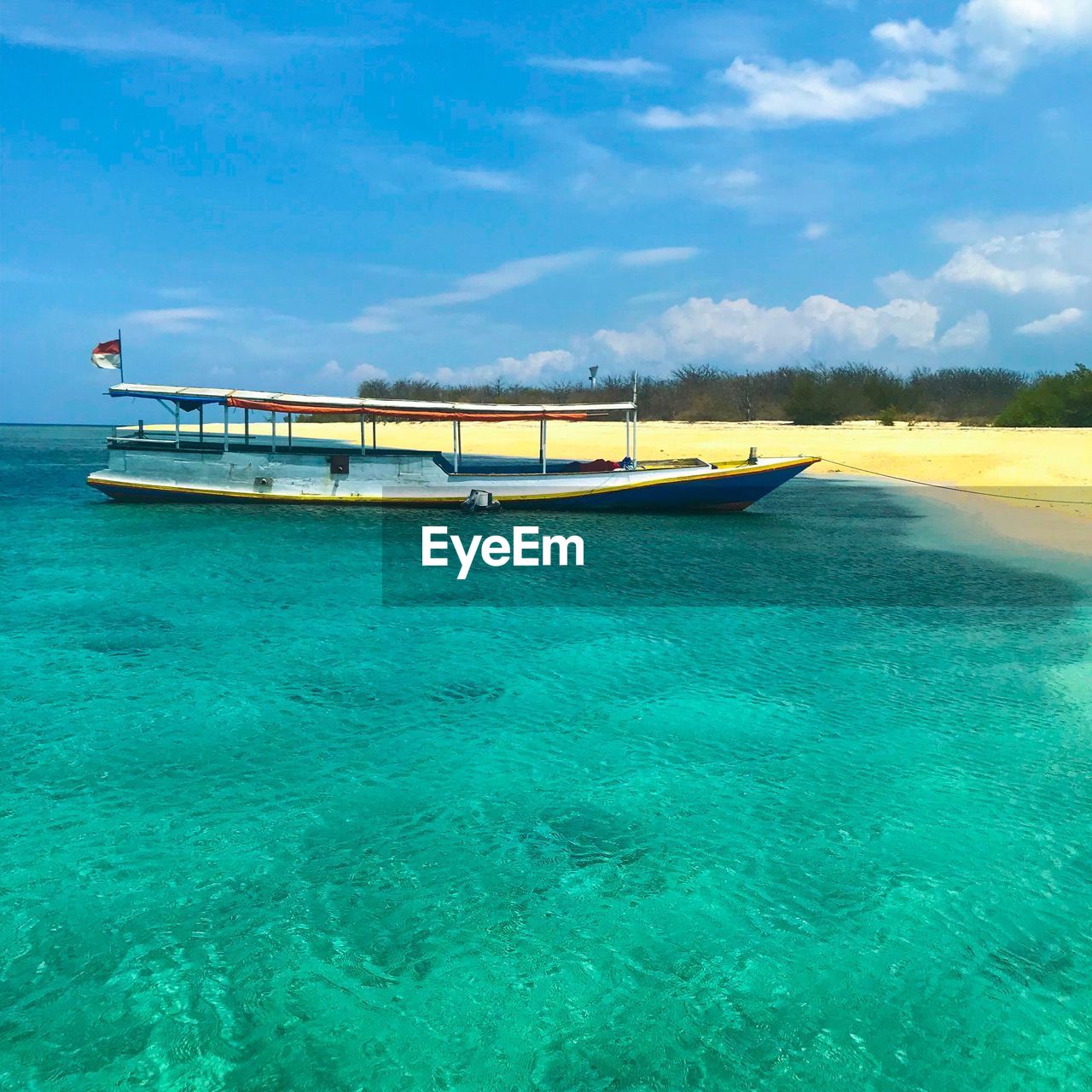 Scenic view of sea against blue sky