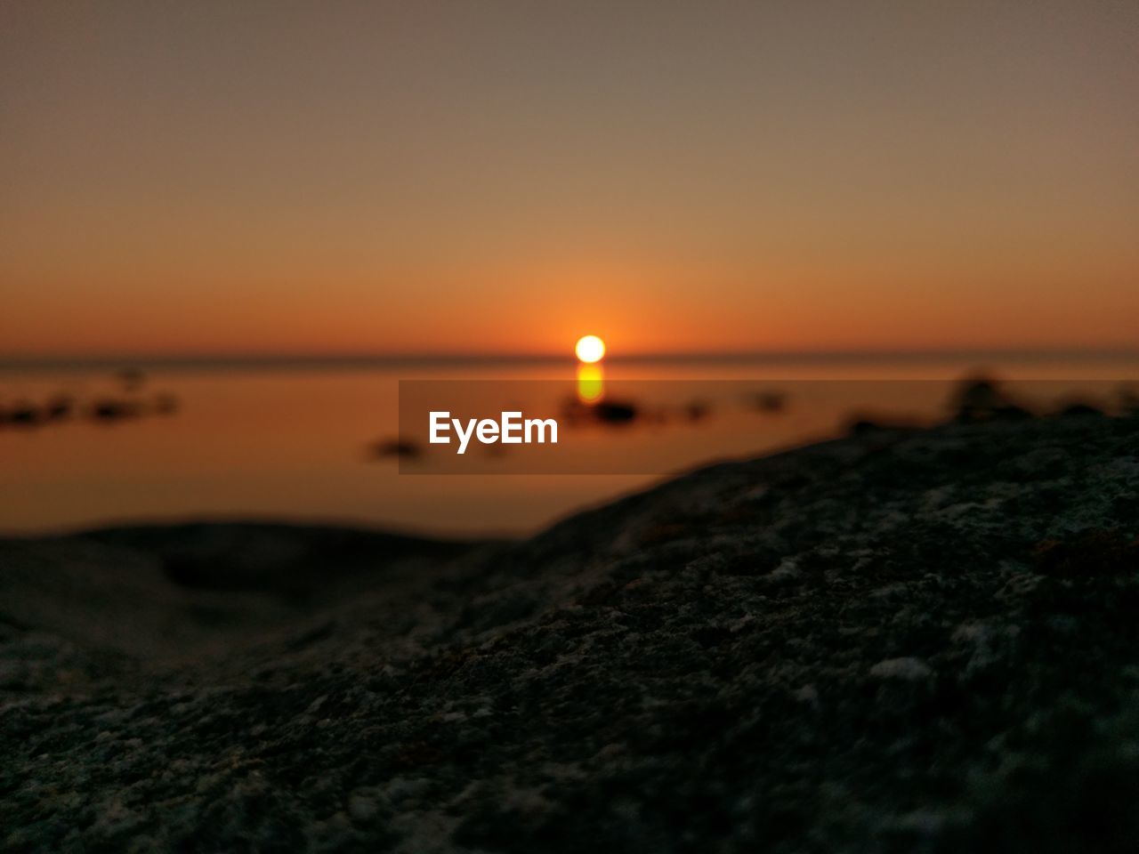 Scenic view of beach and sea against sky during sunset 