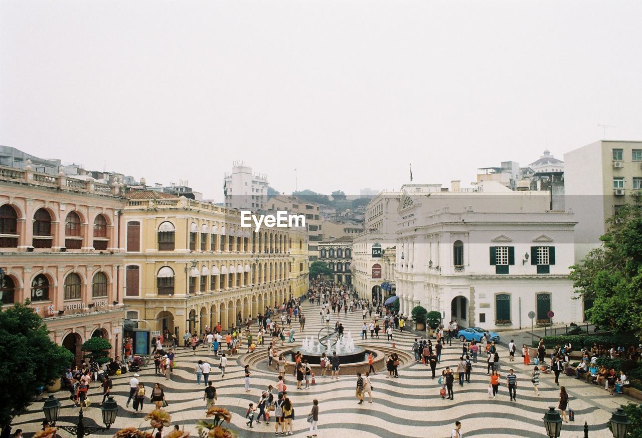 PEOPLE WALKING IN TOWN SQUARE