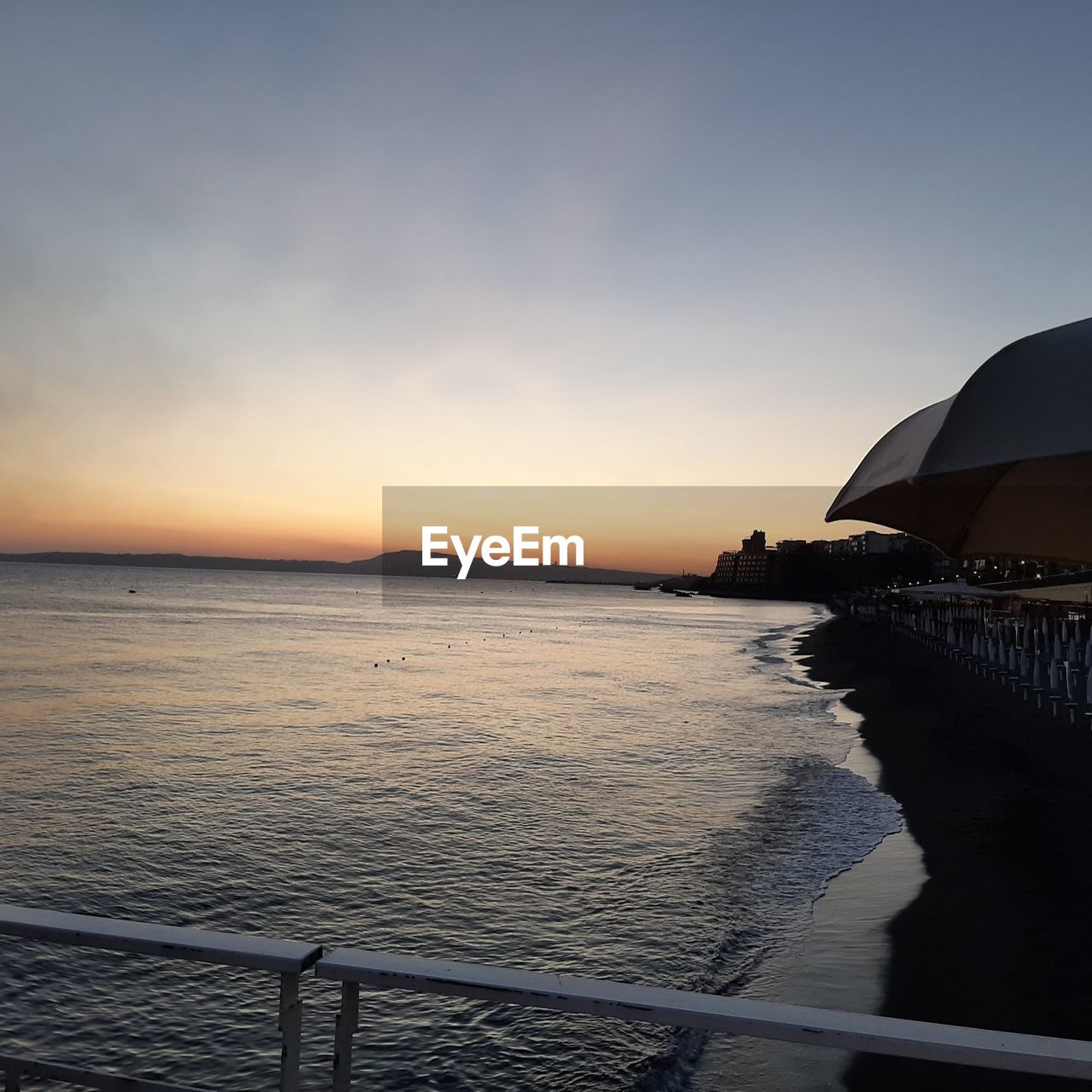 VIEW OF SEA AGAINST SKY DURING SUNSET