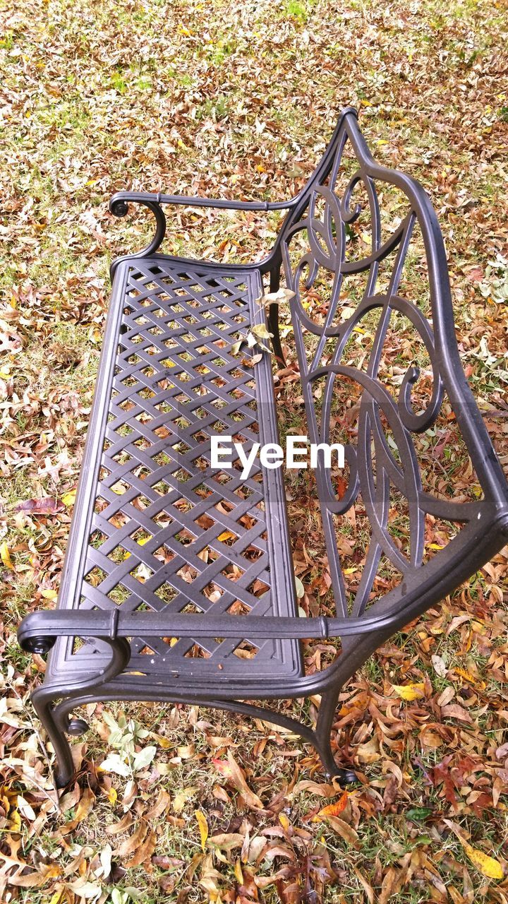 autumn, leaf, change, park - man made space, dry, outdoors, metal, day, nature, no people, outdoor play equipment, tranquility, tree, close-up, beauty in nature, bicycle rack