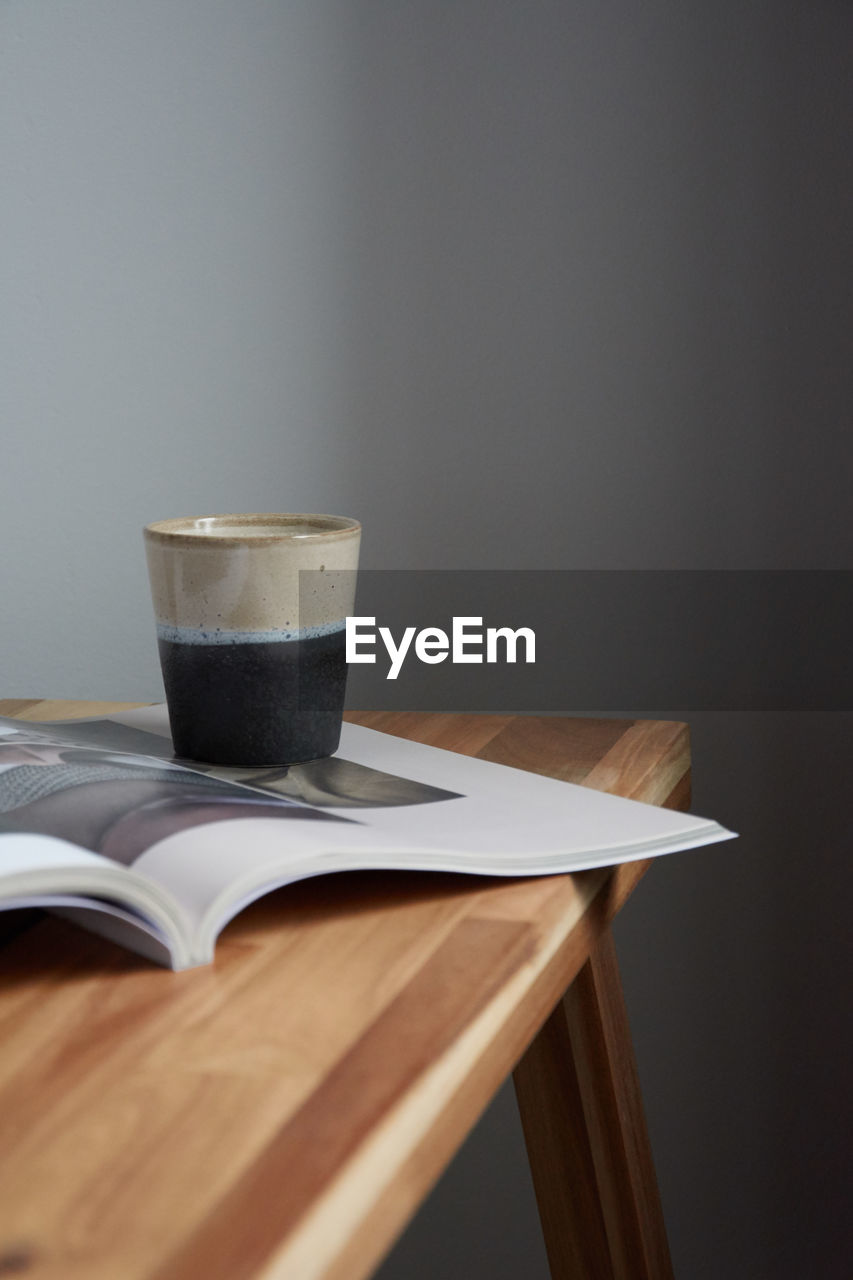 Close-up of coffee cup on table