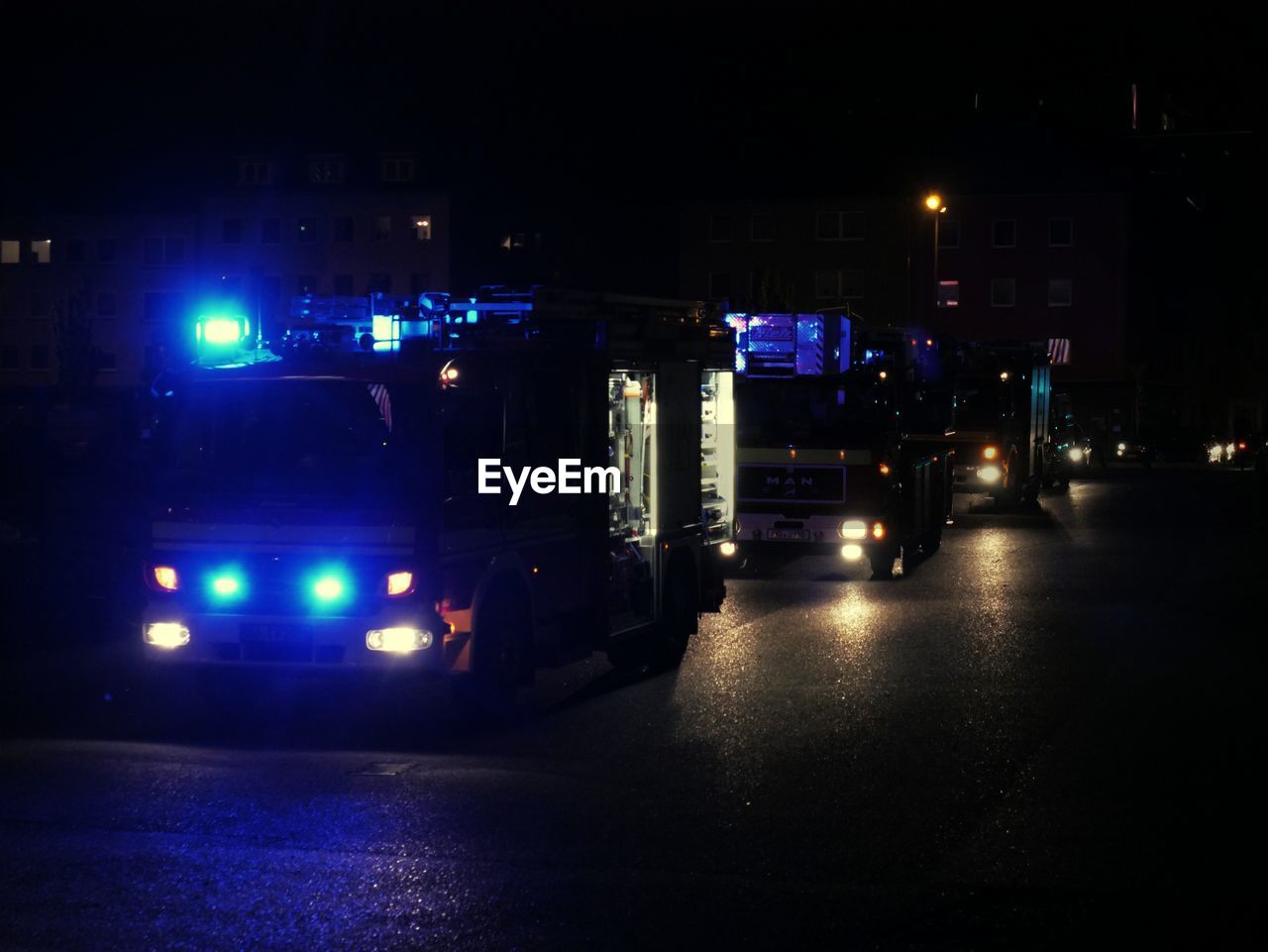 CARS ON STREET AT NIGHT