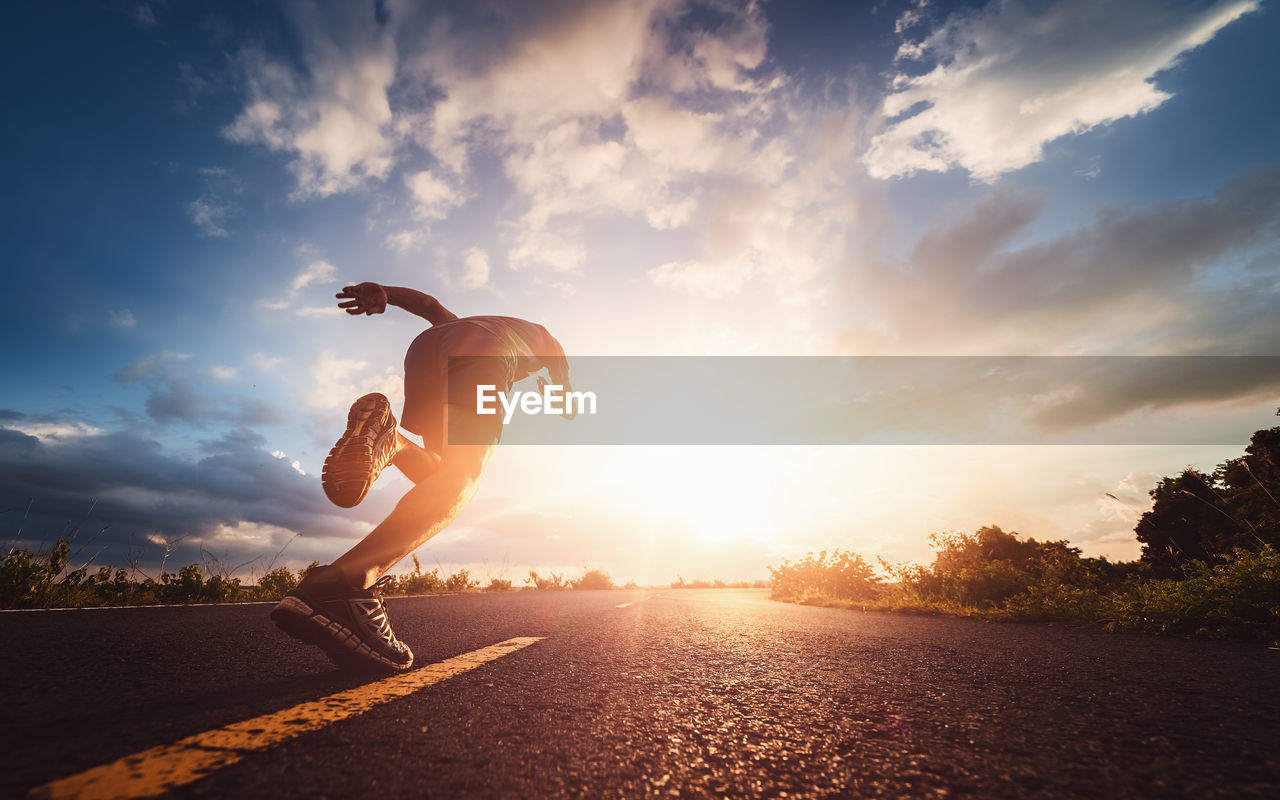 Athlete runner feet running on road, jogging concept at outdoors. man running for exercise.