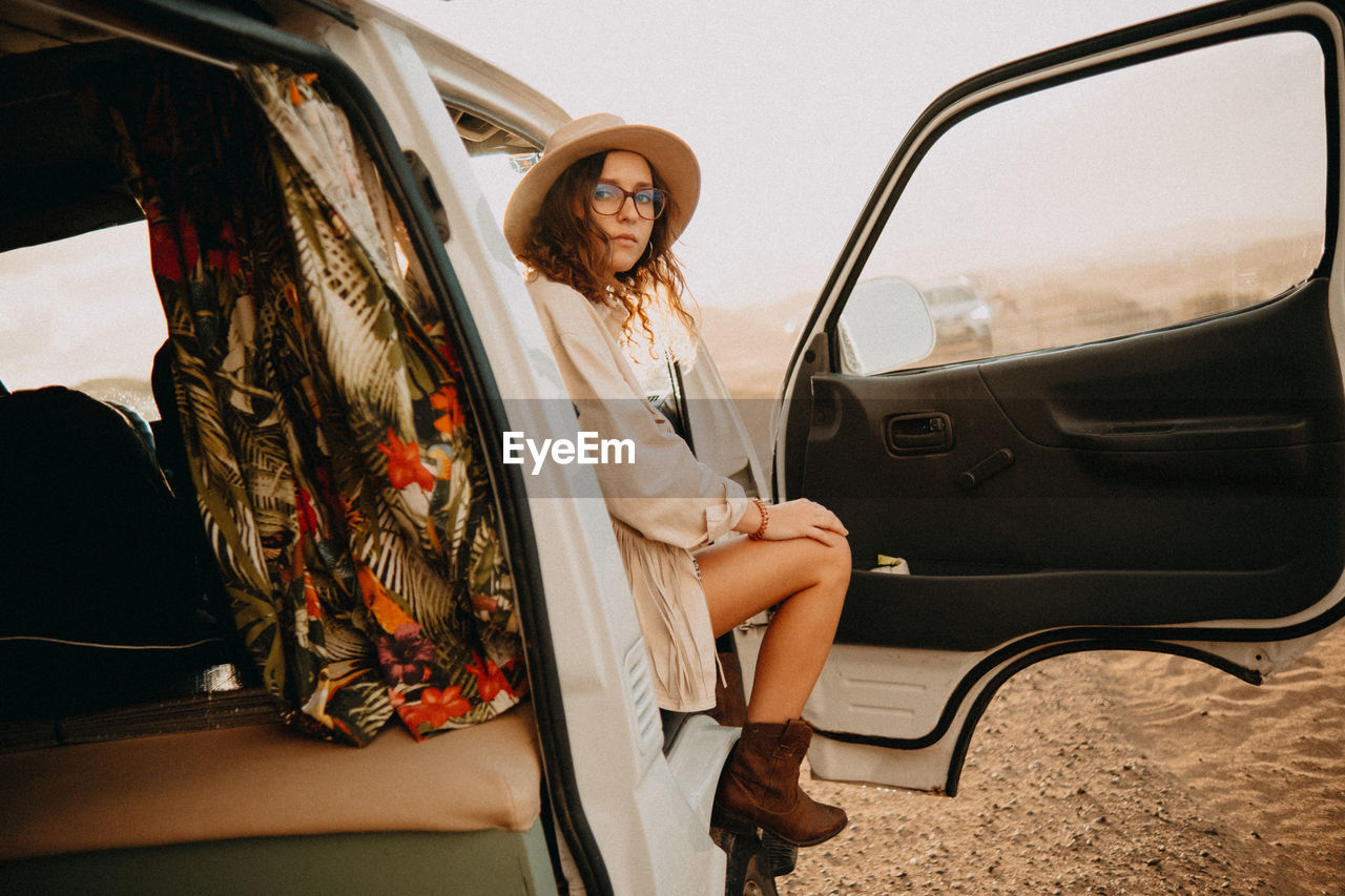 Woman sitting in car