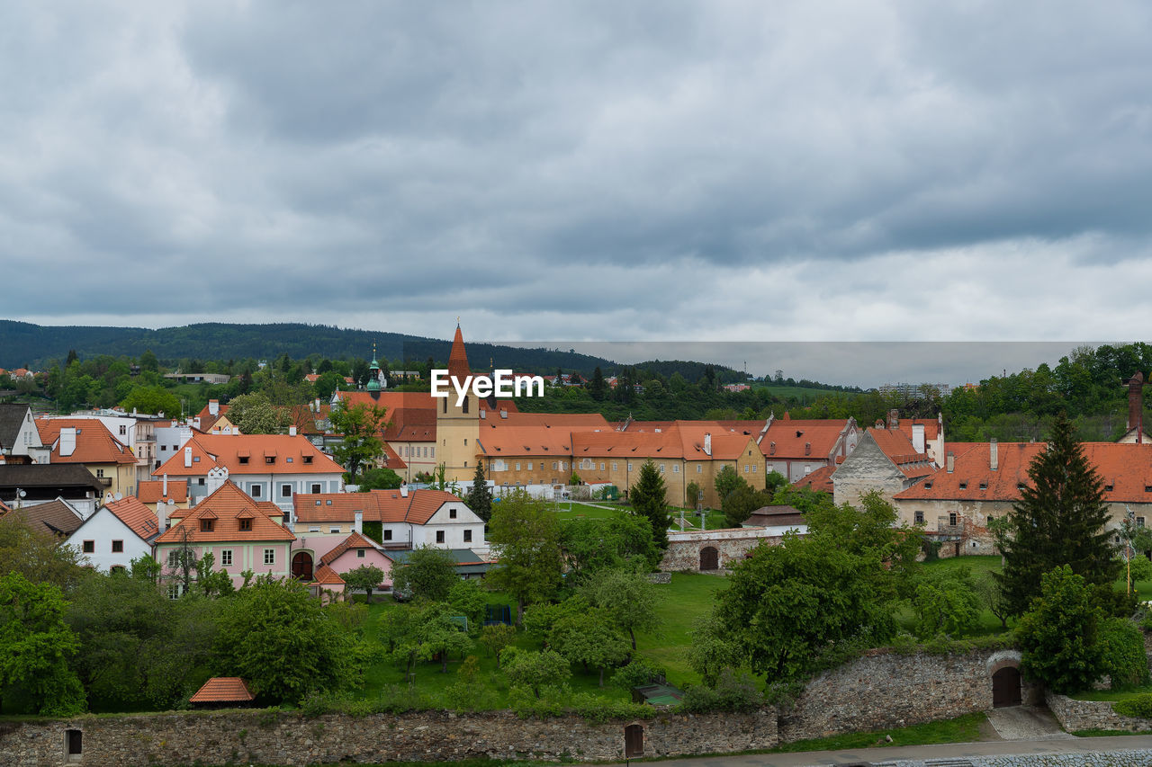 Buildings in town against sky