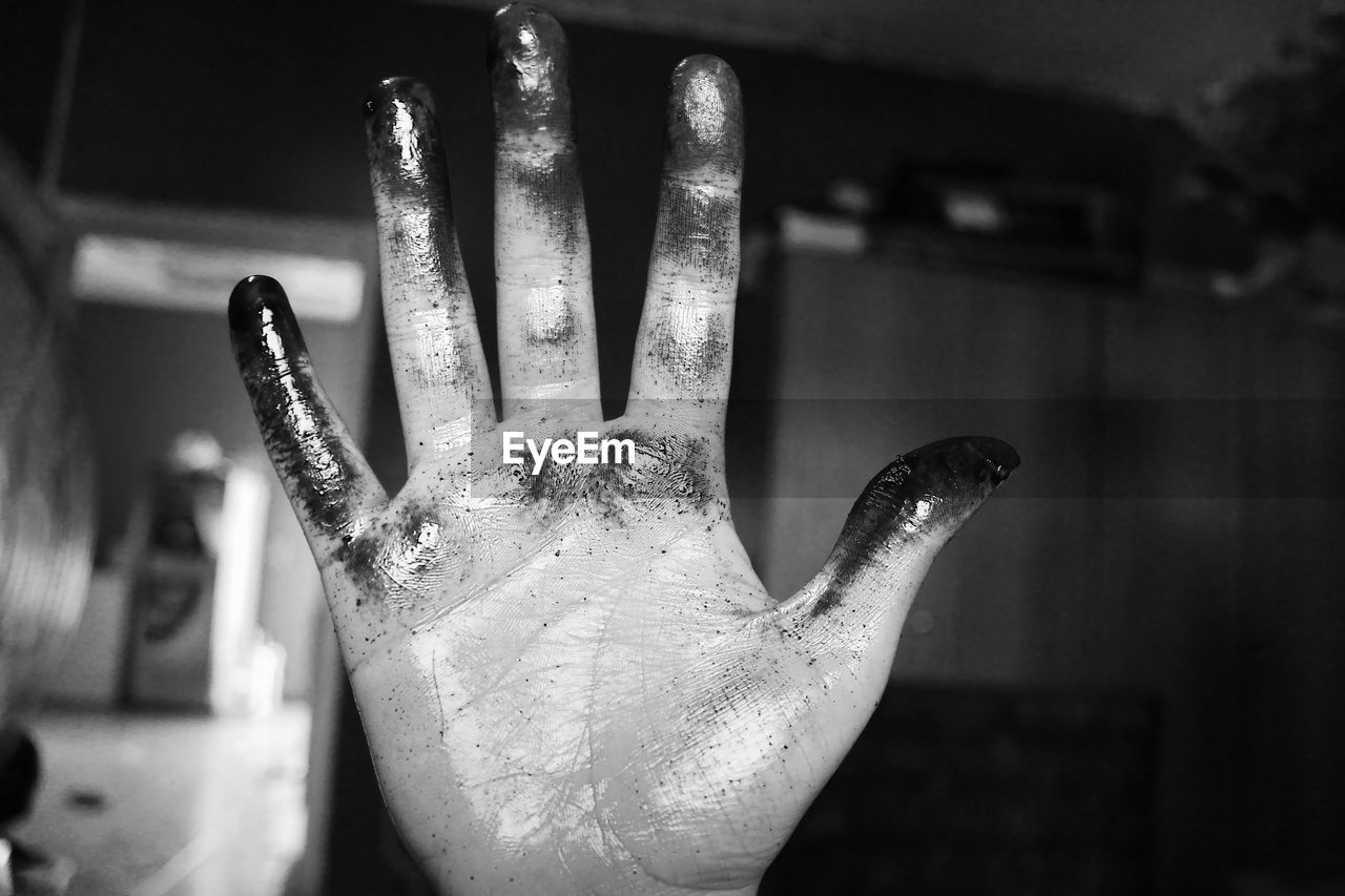 Close-up of messy hand
