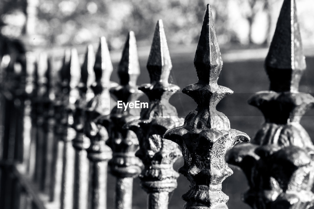 CLOSE-UP OF STATUES IN ROW