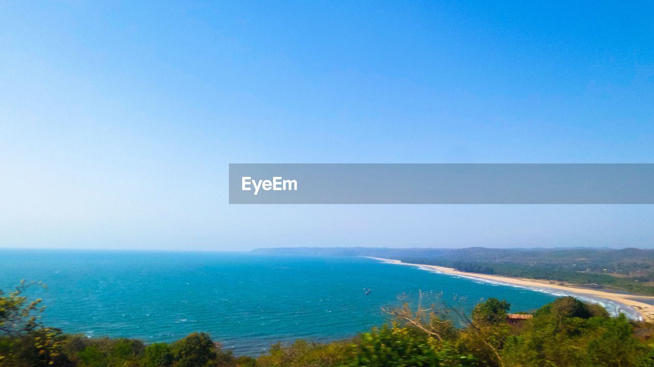 SCENIC VIEW OF BLUE SEA AGAINST CLEAR SKY