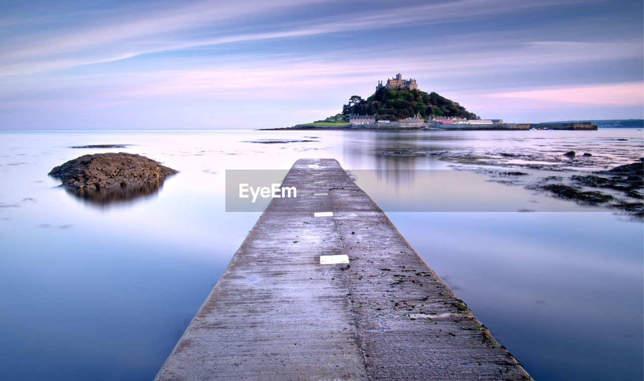 Scenic view ofst michael's mount against sky at sunset