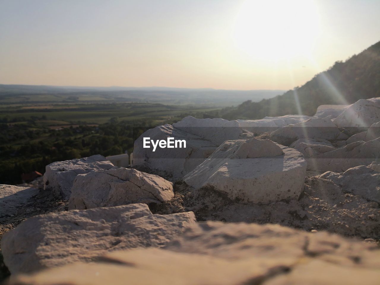 SCENIC VIEW OF LAND AGAINST SKY AT SUNSET