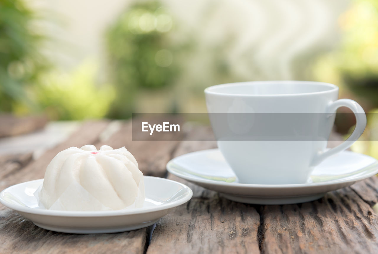 CLOSE-UP OF TEA IN PLATE ON TABLE