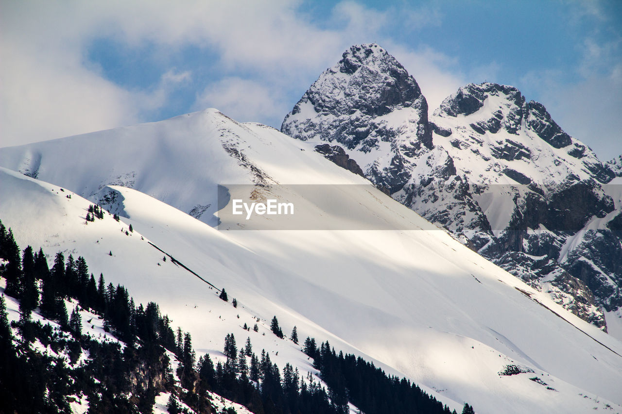 Scenic view of mountains against sky during winter