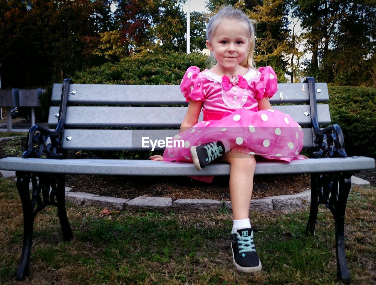 PORTRAIT OF HAPPY GIRL IN PARK