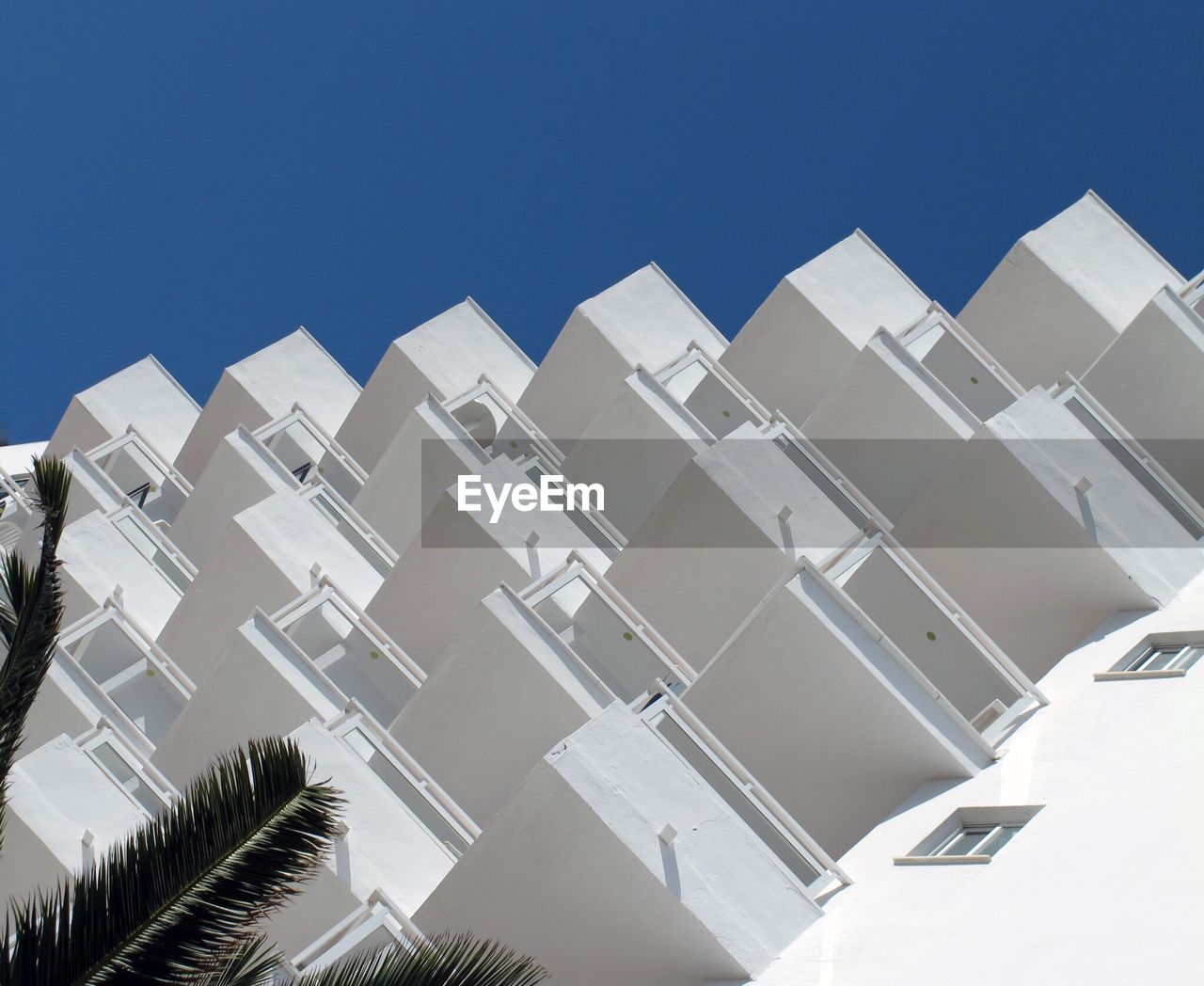 LOW ANGLE VIEW OF BUILDINGS AGAINST CLEAR SKY