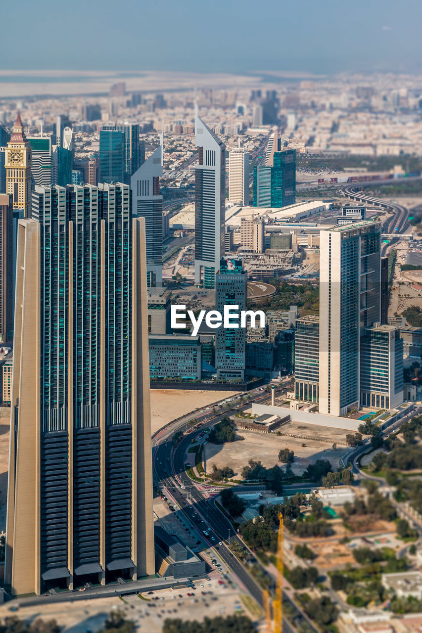 High angle view of buildings in city against sky