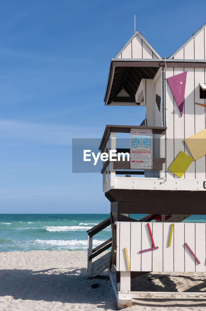 Close-up lifeguard tower on the beach in south miami beach, florida. vertical screen.