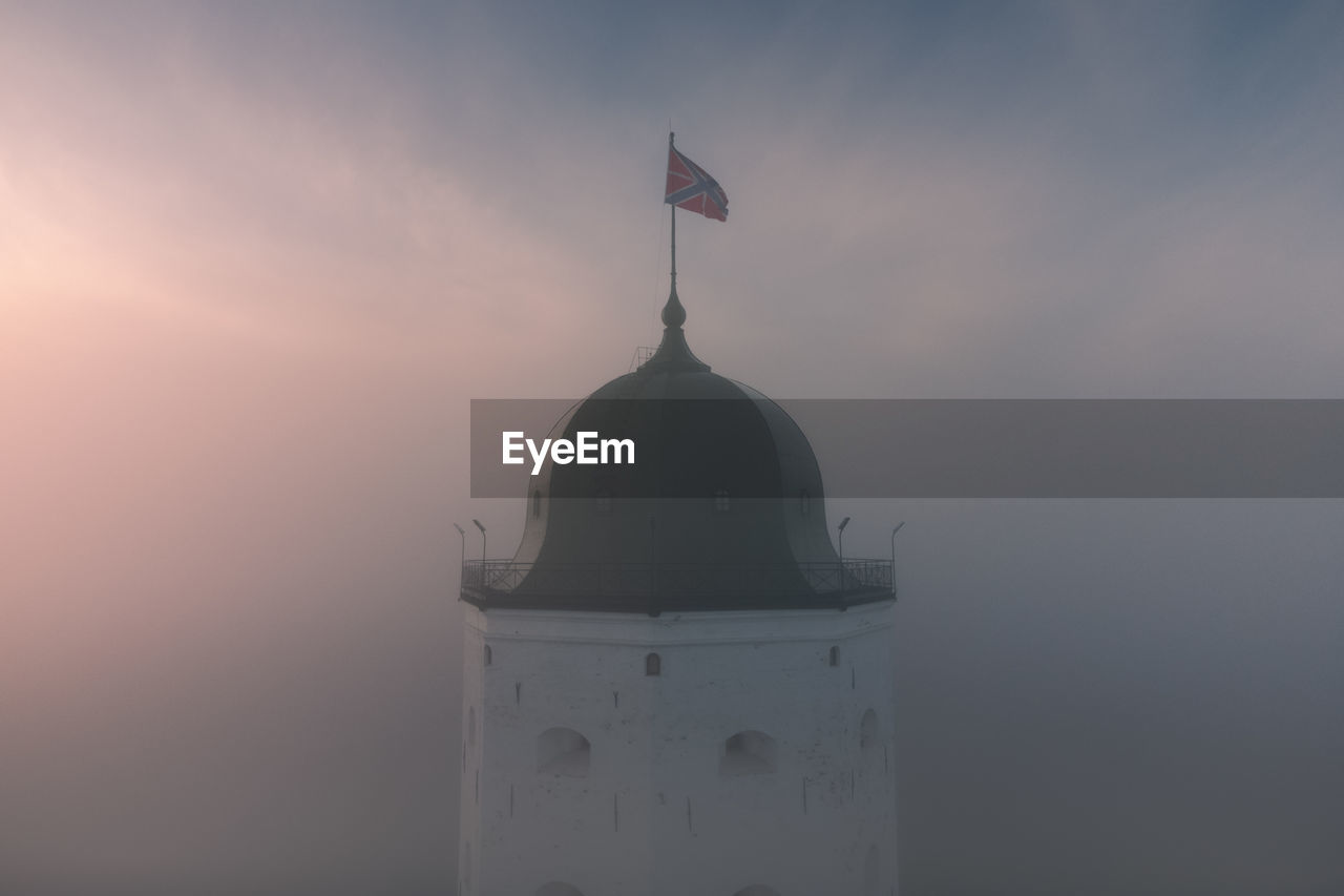 Aerial view of the fog-shrouded tower of st. olaf in the vyborg castle. cultural heritage of russia