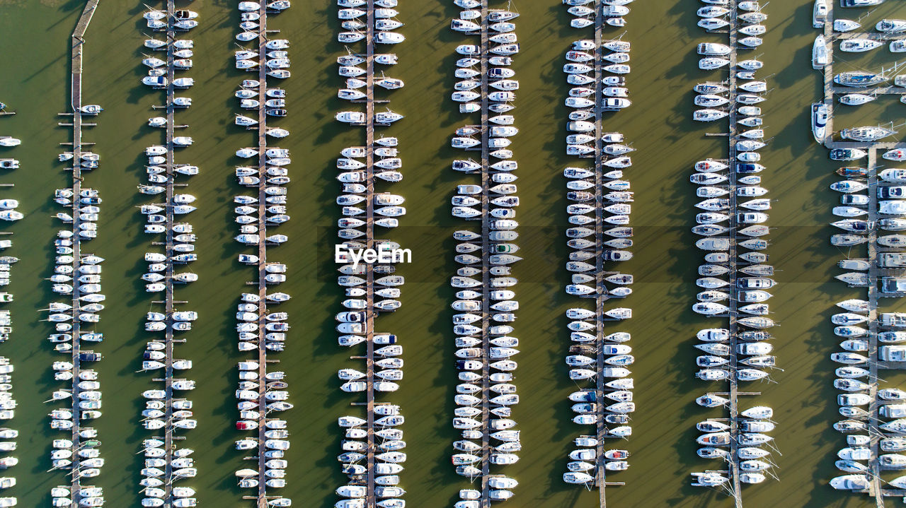 Aerial view of boats in sea at harbor