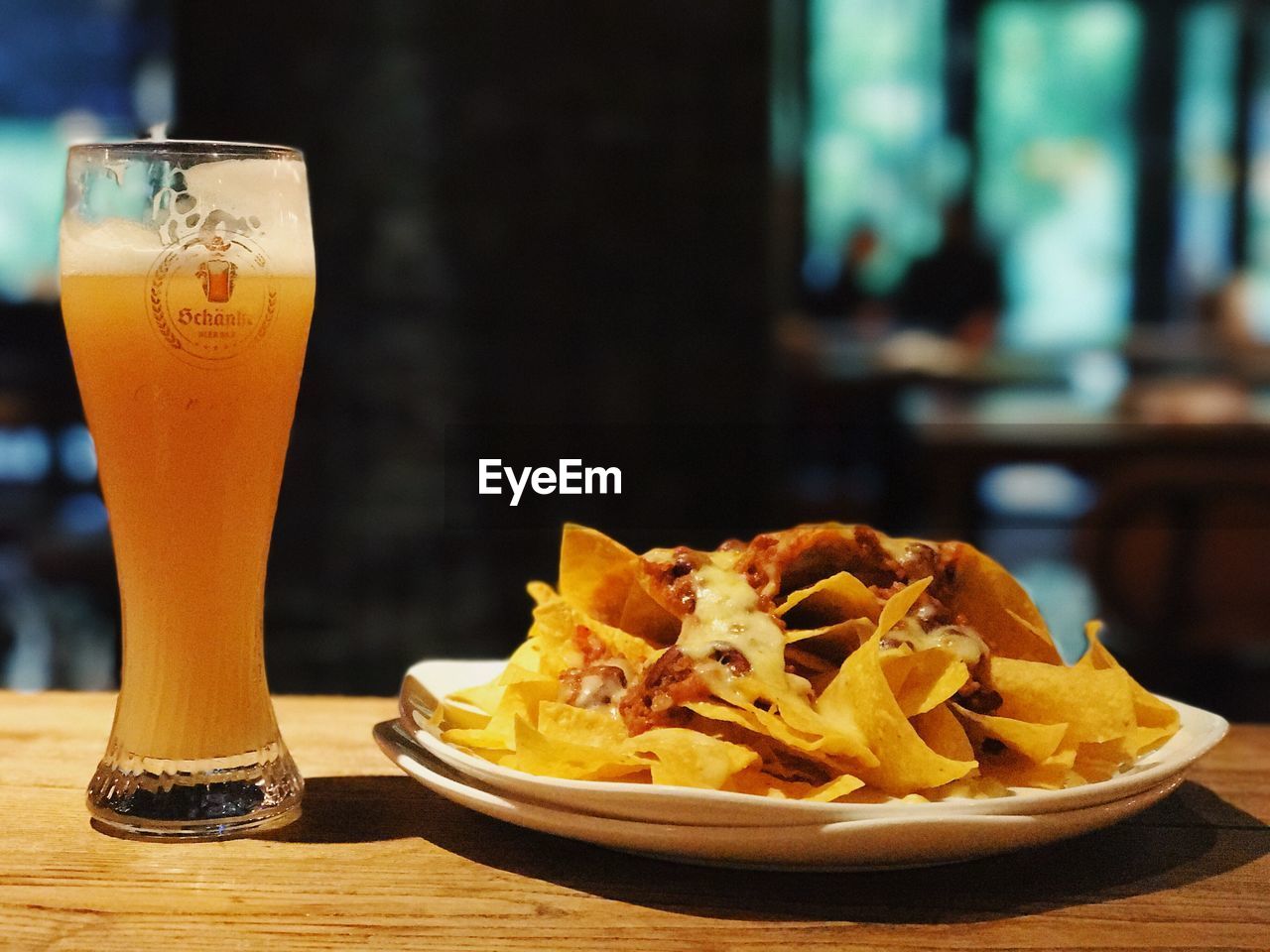 CLOSE-UP OF DRINK IN PLATE ON TABLE