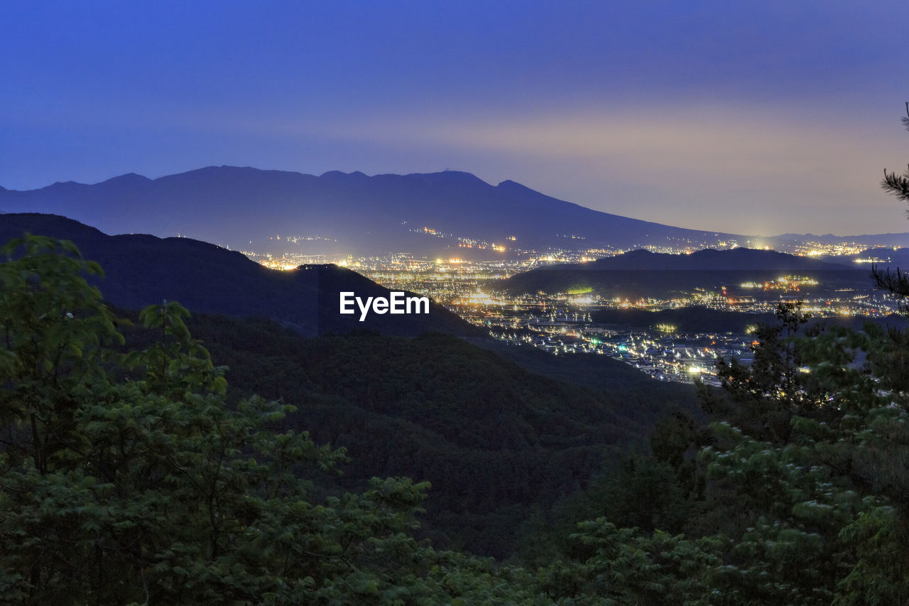 Scenic view of mountains against sky at sunset