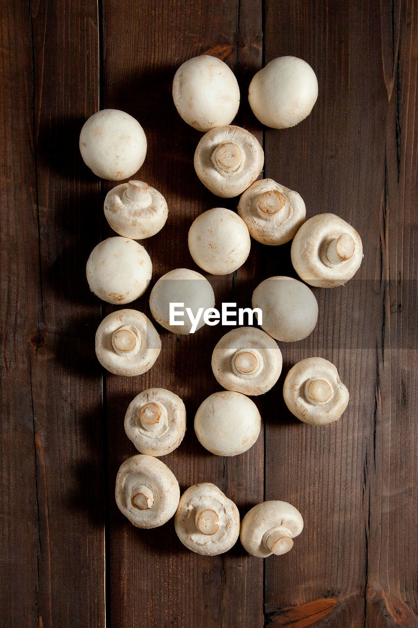 Mushrooms on a brown wooden background. table top view