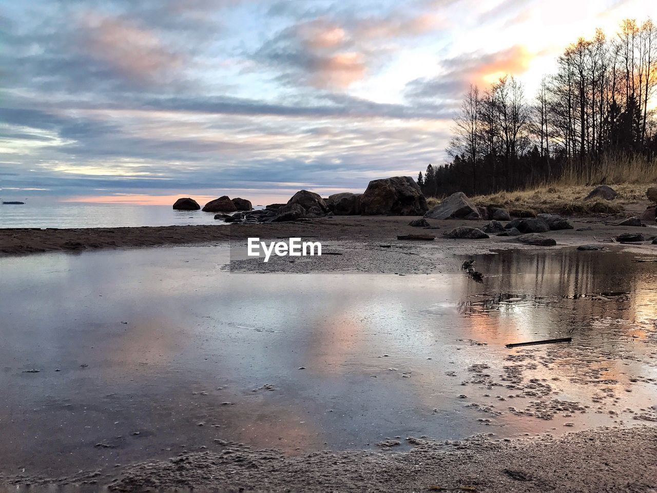 Scenic view of sea against sky at sunset