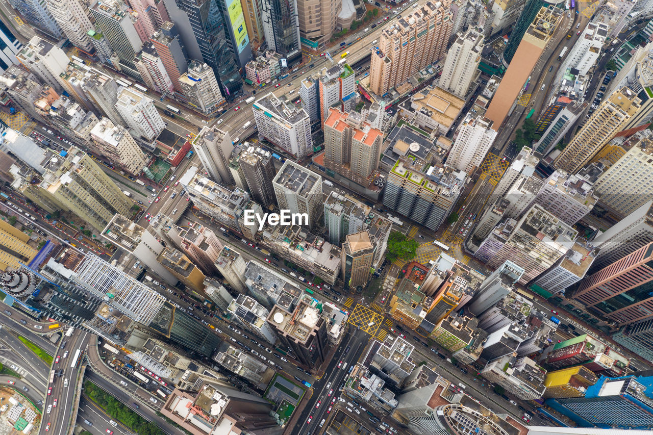 High angle view of illuminated street amidst buildings in city