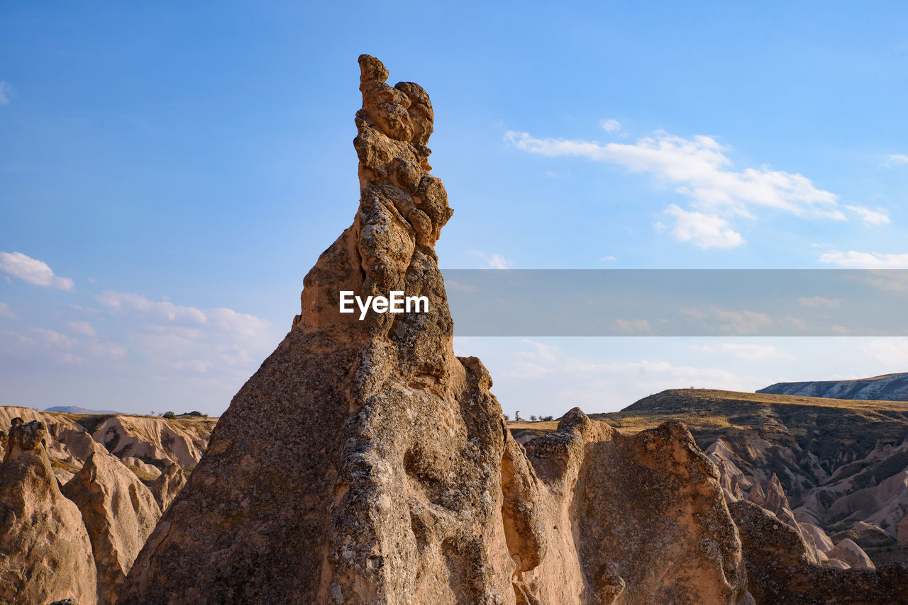 LOW ANGLE VIEW OF ROCK FORMATIONS