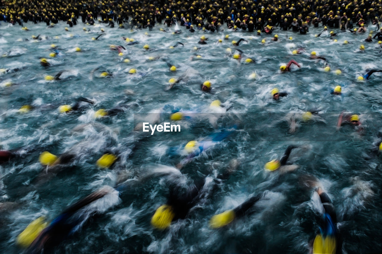 High angle view of people swimming in triathlon
