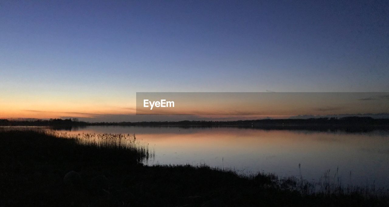 VIEW OF LAKE AT SUNSET