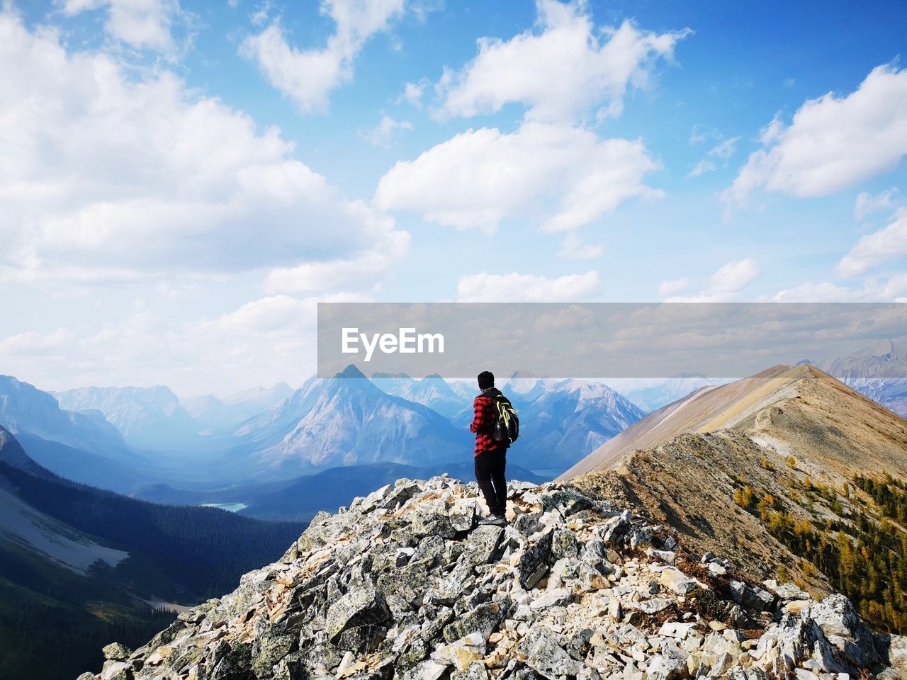 When nature make you feel small, a picture of a human being on top of thetent ridge trail.