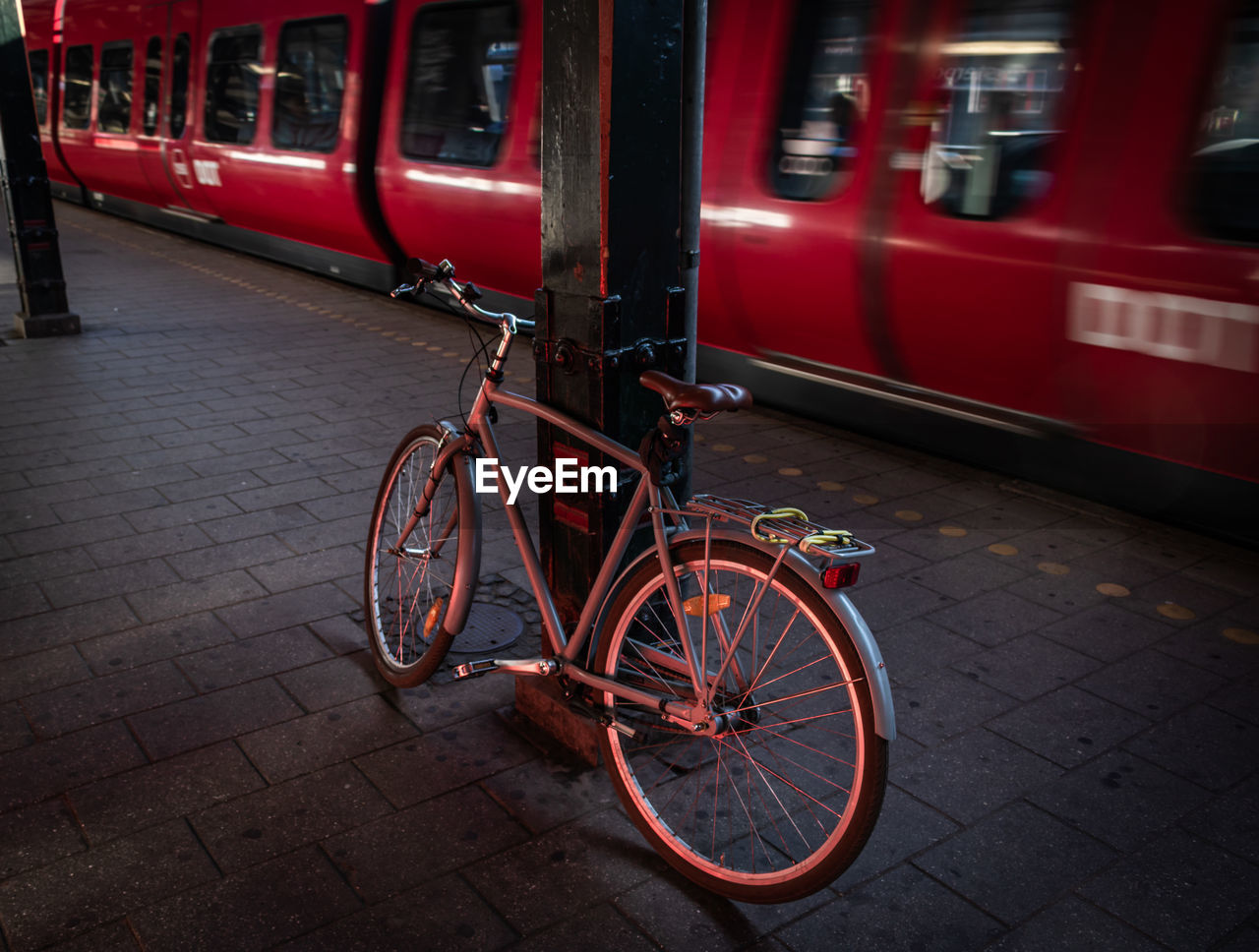 Bicycle parked at railroad station