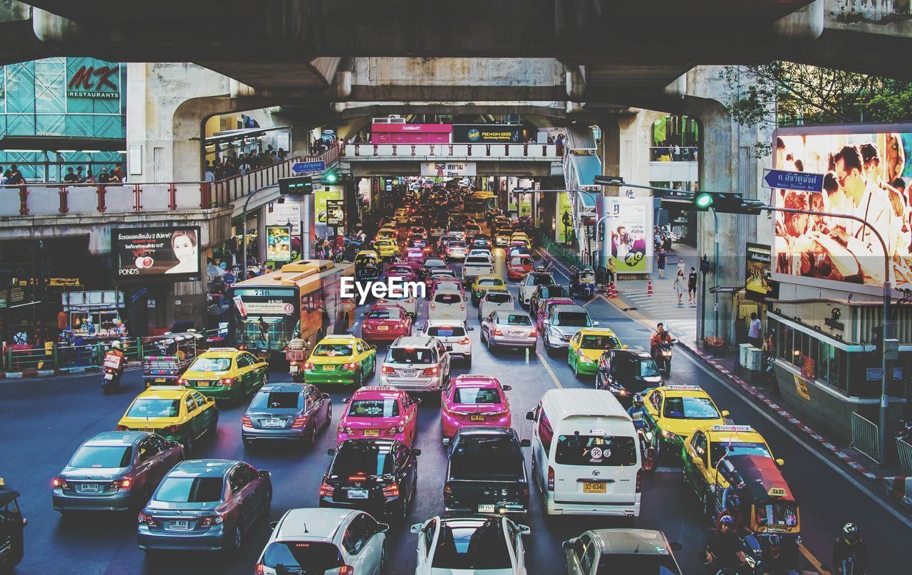 Traffic on city street under bridge