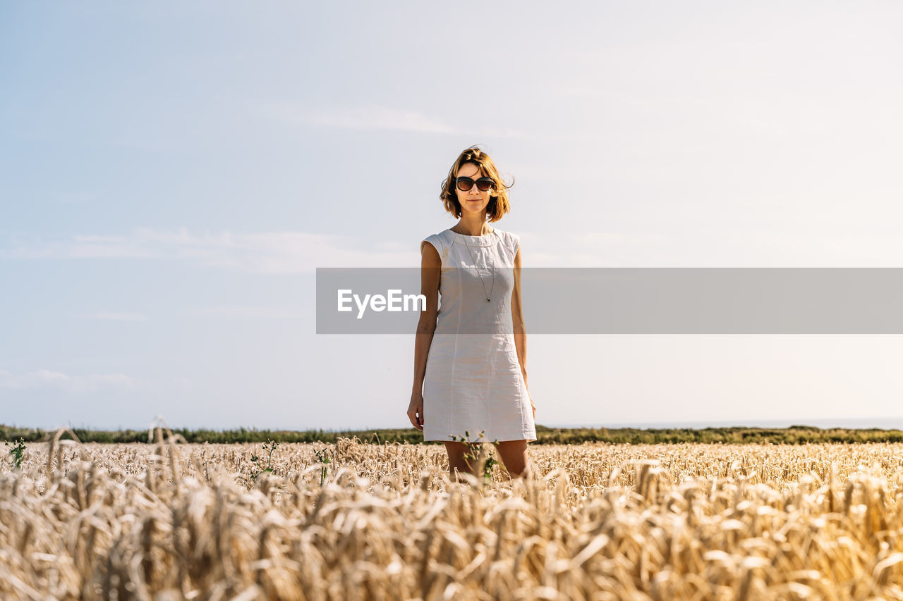 Summer concept, caucasian middle-aged woman in the countryside