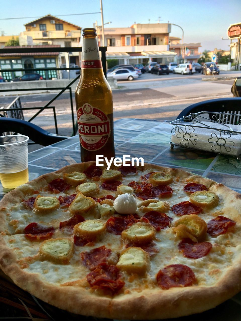 CLOSE-UP OF PIZZA IN BOTTLE