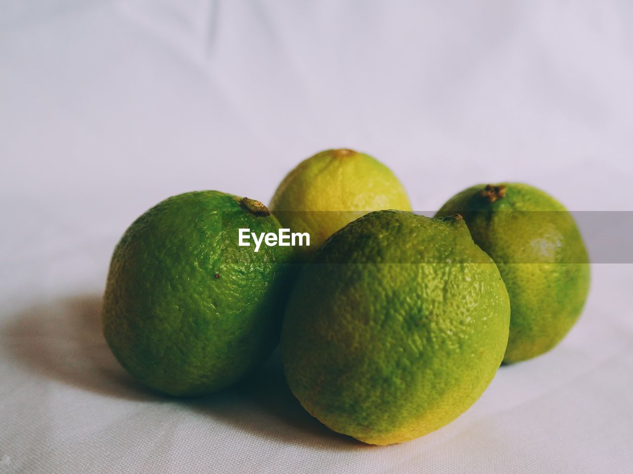 Close-up of green limes