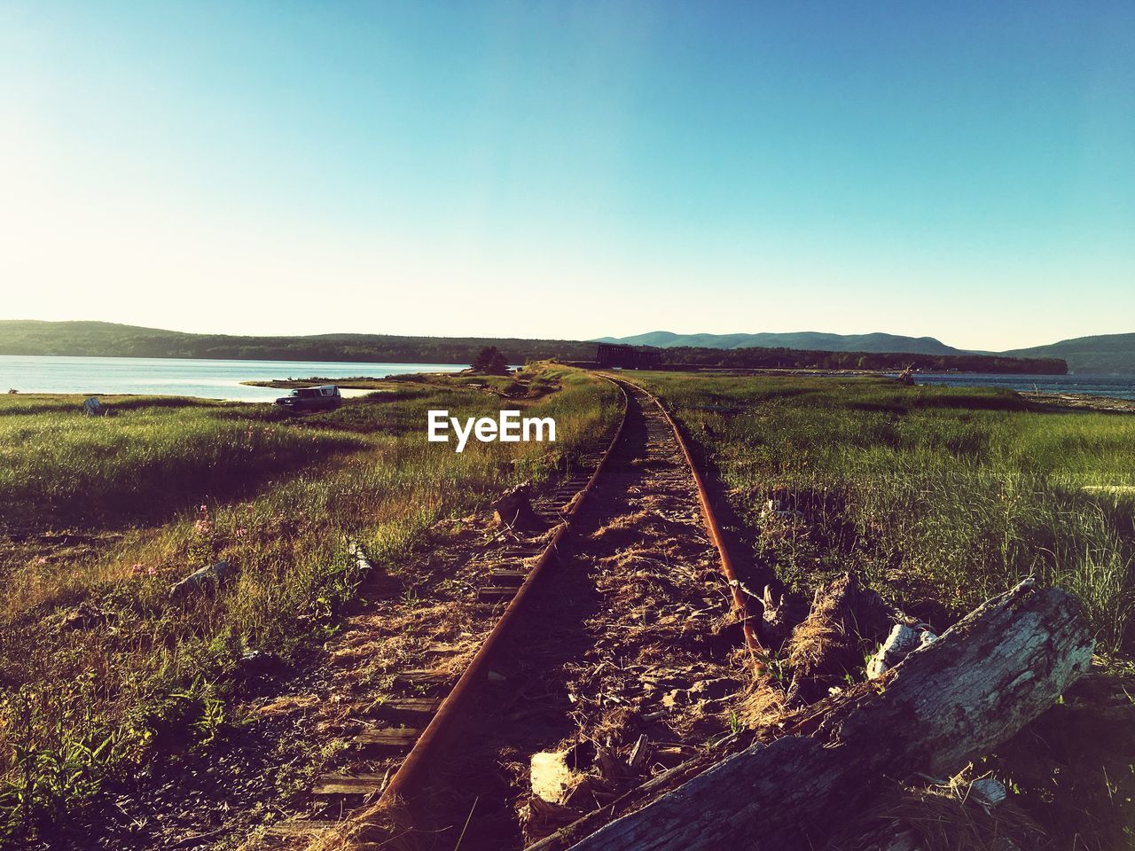 SCENIC VIEW OF RAILROAD TRACKS AGAINST SKY