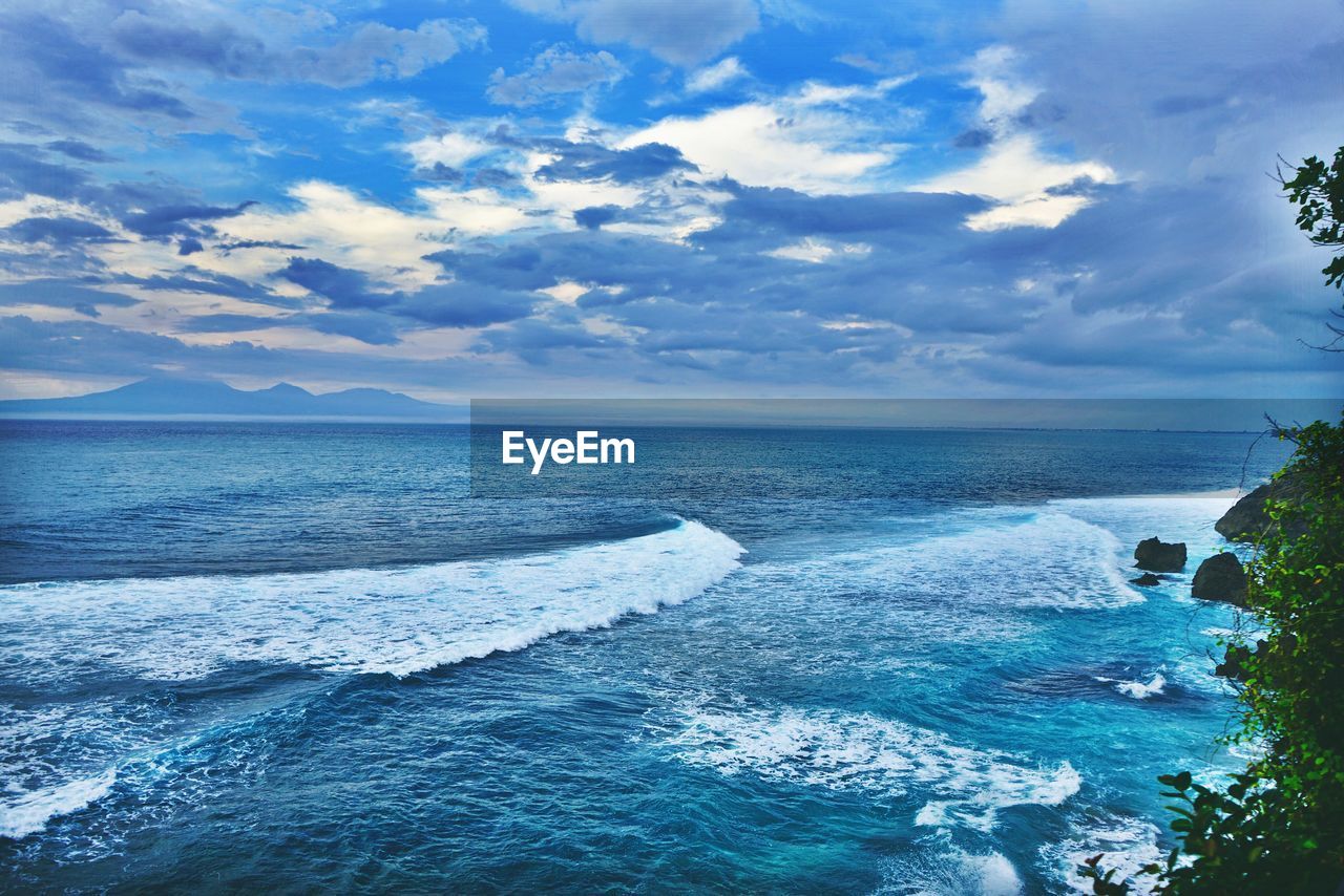 View of calm sea against cloudy sky