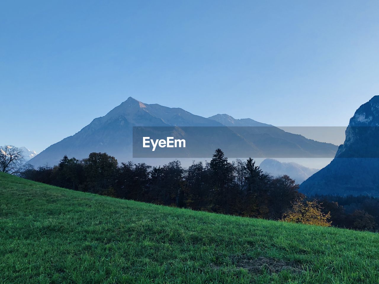 SCENIC VIEW OF LANDSCAPE AND MOUNTAINS AGAINST SKY