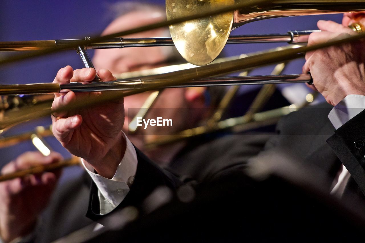 Close-up of man playing trumpet