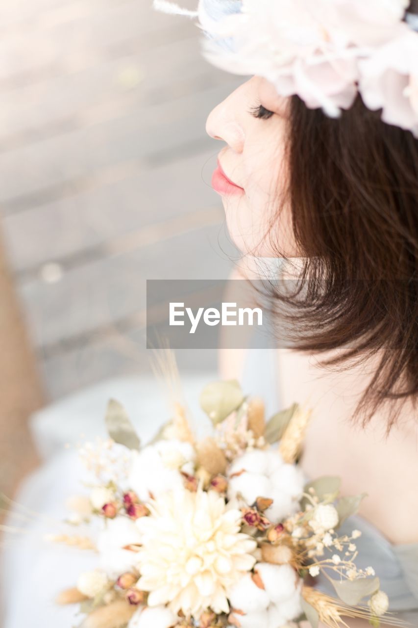 Close-up of beautiful woman holding bouquet