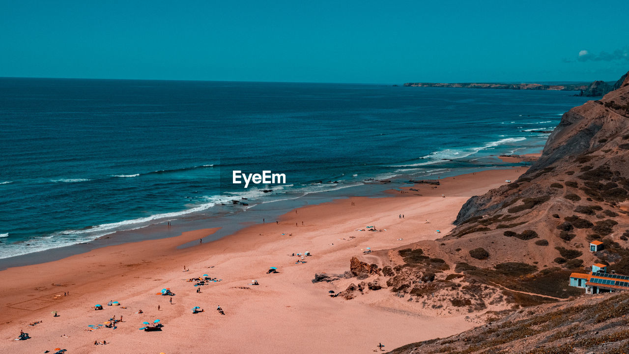 Scenic view of beach against clear sky